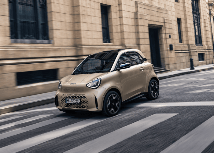 Champagne Smart Car in Motion